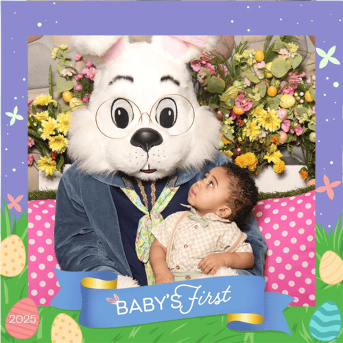 Baby looks up at the Easter Bunny
