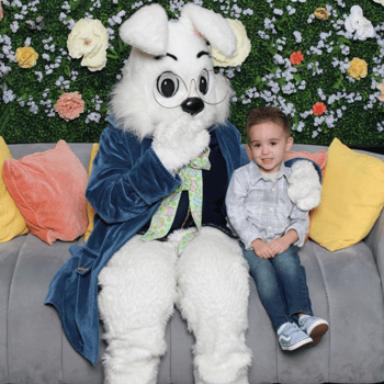 A little boy smiling with the Easter Bunny