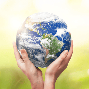 Picture of the Earth in someones hands.