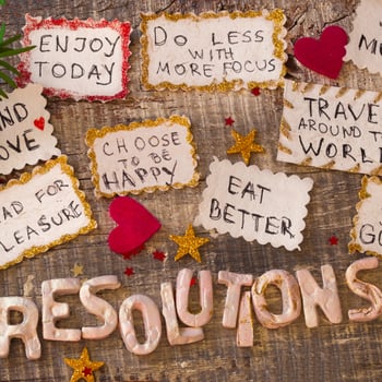 A list of new years resolutions written on paper.
