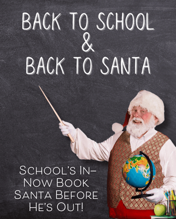 Santa with a globe and chalkboard.
