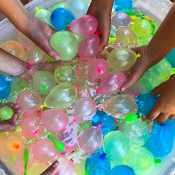A bucket of water balloons.