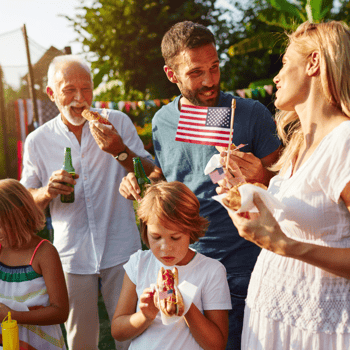 A family celebrating 4th of July together outside.
