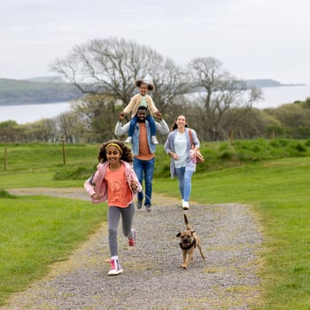 A family on an afternoon walk together.
