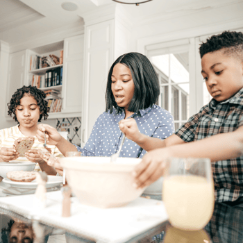 A family eating breakfast together.