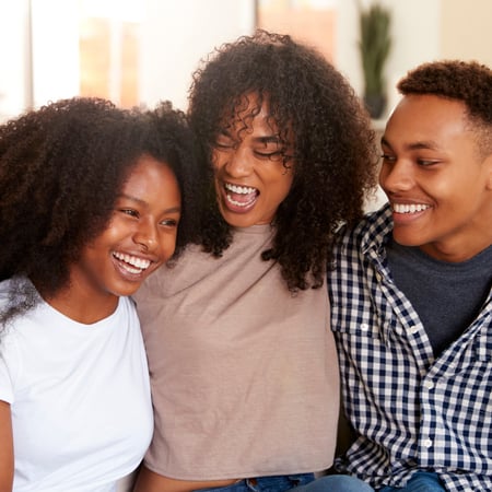Siblings laughing together.