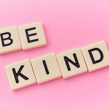 "Be Kind" written in scrabble letters.