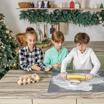 Kids baking Christmas cookies.