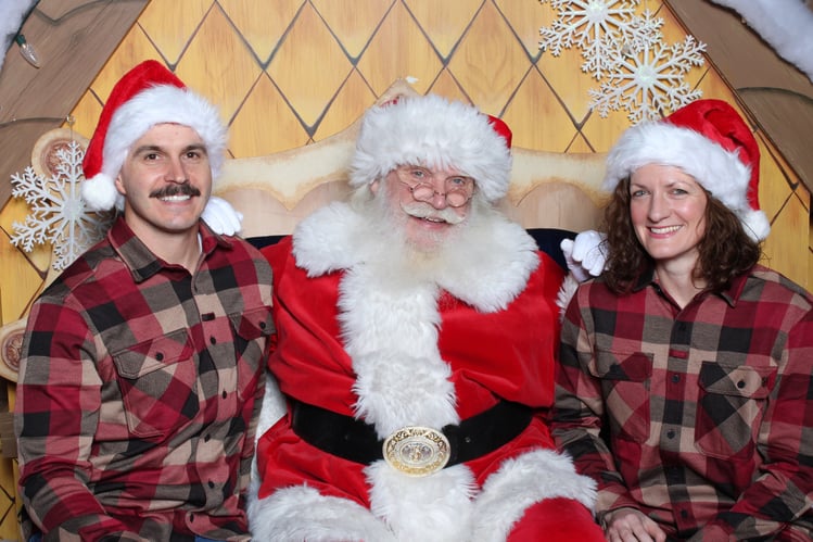 couple smiling with santa