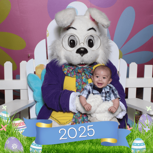 Adorable baby with bow tie meets the Easter Bunny for the first time