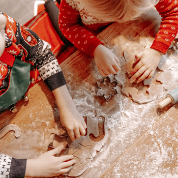 Kids baking Christmas cookies.