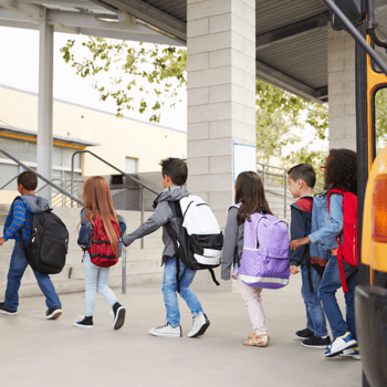 Students getting off the school bus.
