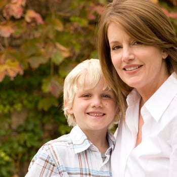 A mom and her son taking photos.