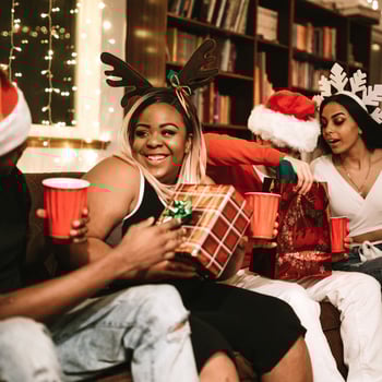 A group of friends doing a gift swap.