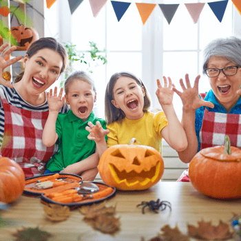 A family carving pumpkins