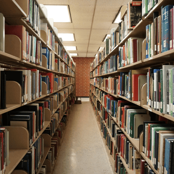 A library hallway lined by books.