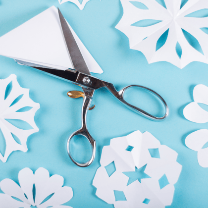 Paper snowflakes against a blue backdrop