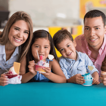 A family eating ice cream together.