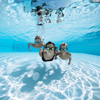 Kids swimming under water.