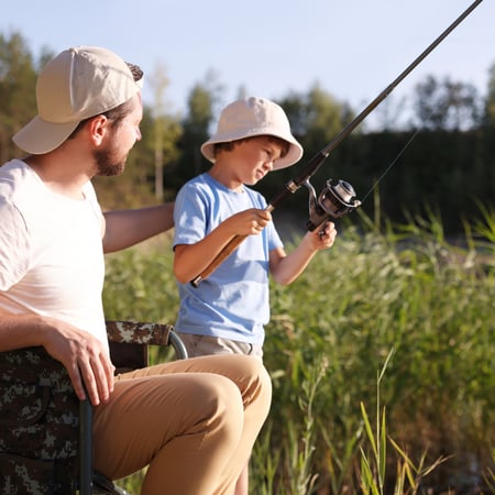 A dad and his son fishing.