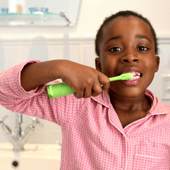 A little boy brushing his teeth.