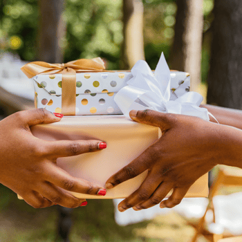 Two people exchanging gifts.