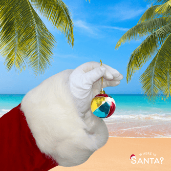 Santa's hand holding a beach ball ornament.