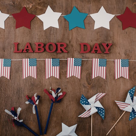 Red, white, and blue decor with red letters that say Labor Day.
