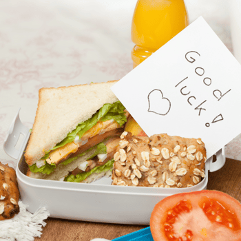 A note next to a sandwich that says "Good Luck!"