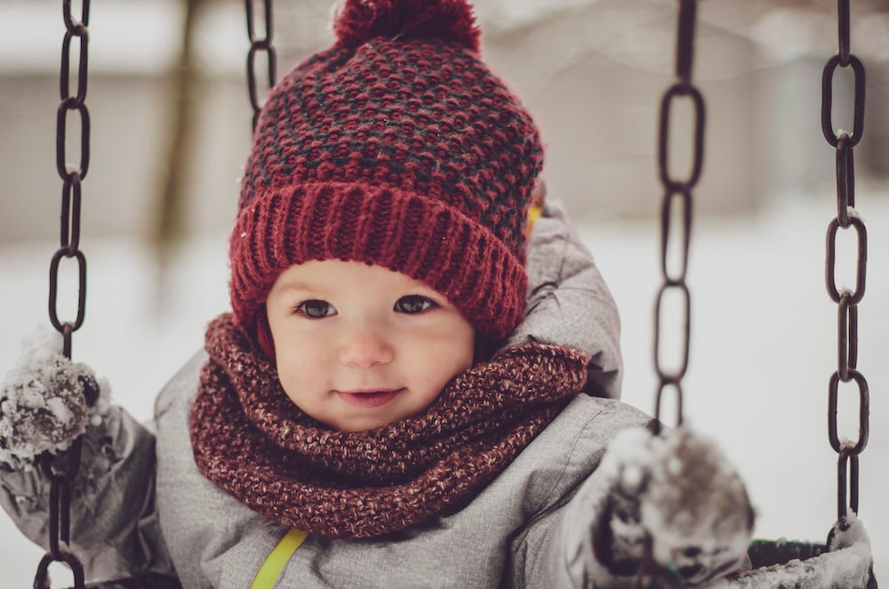 baby on a playground swing