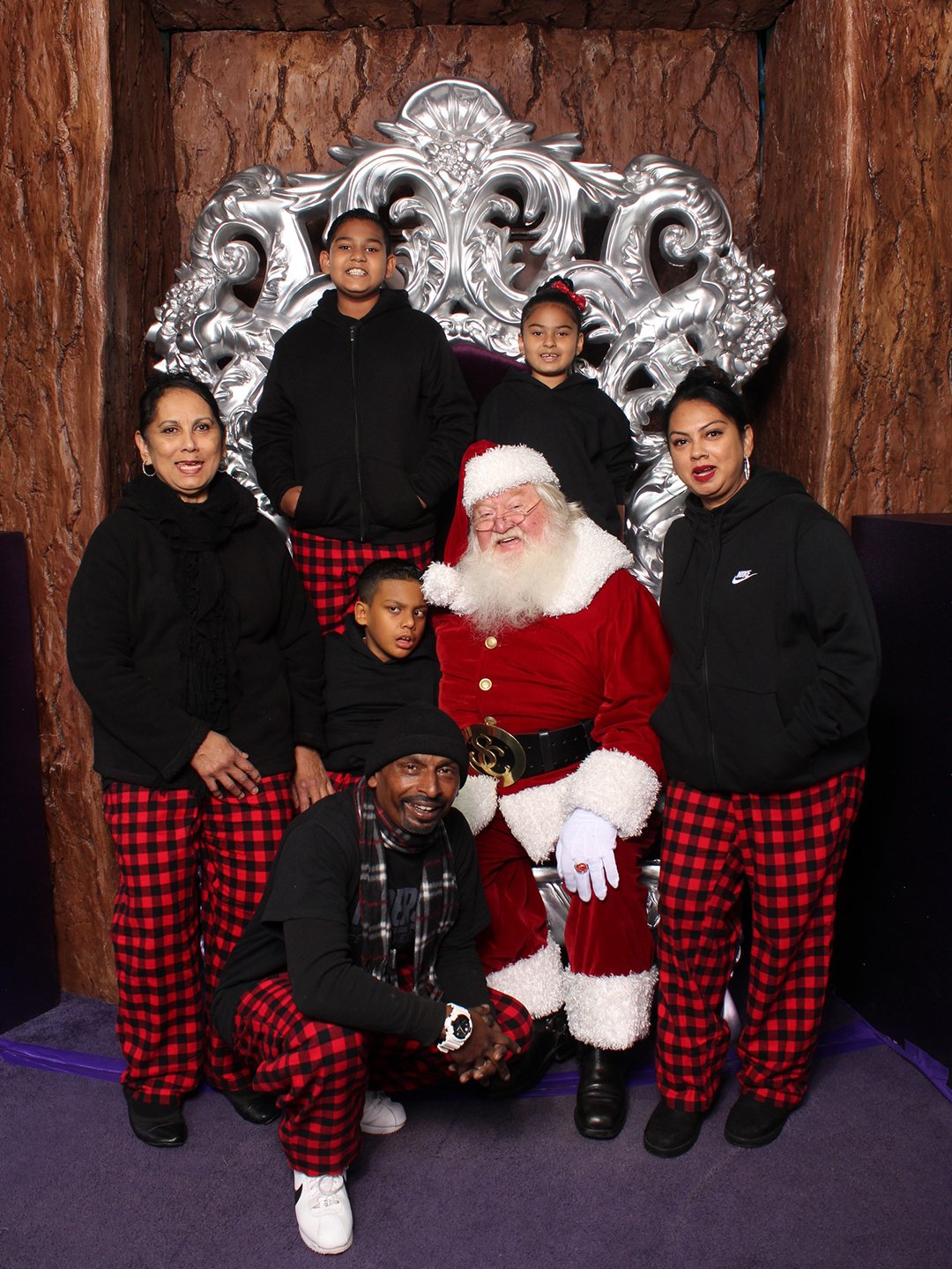 family visiting with santa