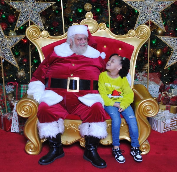 Little girl with autism visiting Santa at Dadeland Mall