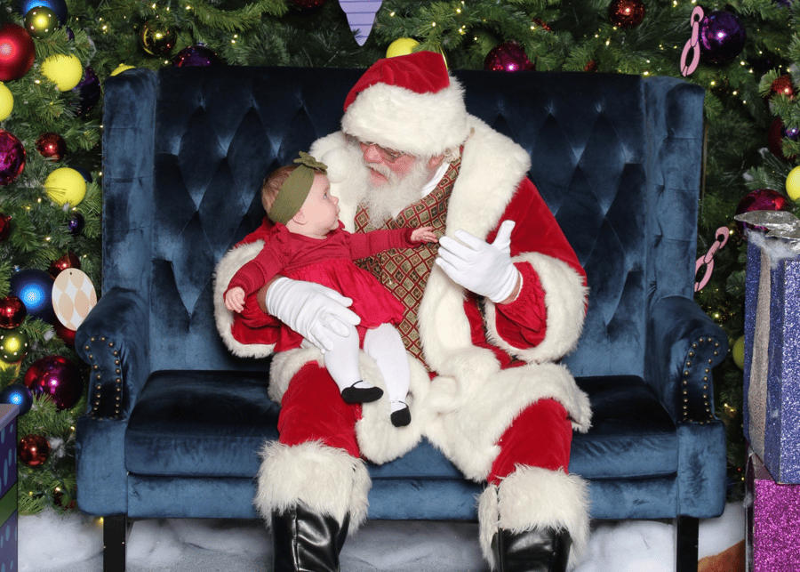 santa claus holding a baby