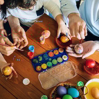 Kids painting Easter eggs.