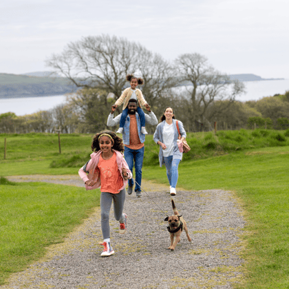 Family on a walk outside on an autumn day.