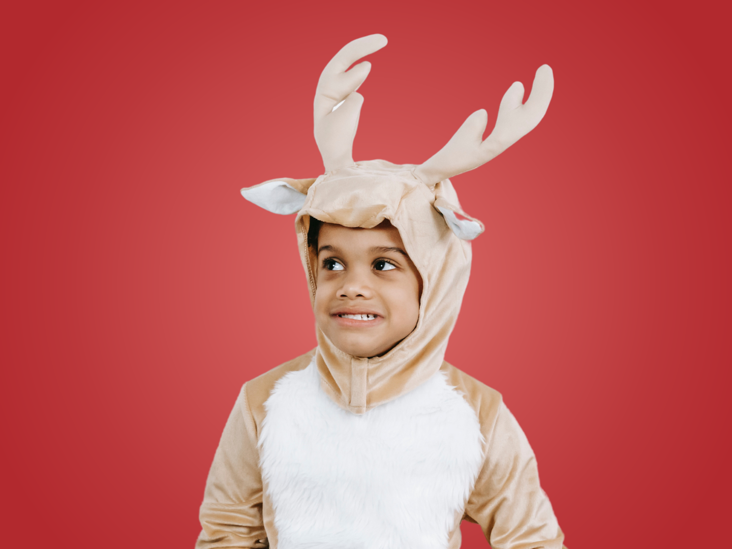 little boy in reindeer costume