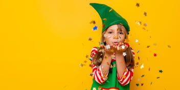 little girl in an elf costume