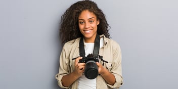 woman holding DSLR camera digital photo photographer