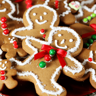 Gingerbread cookies with white icing around them.