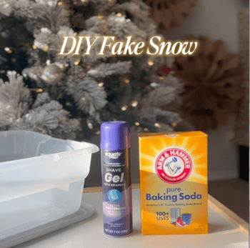 A plastic bin with a can of shaving cream and box of baking soda with a Christmas tree in the background.