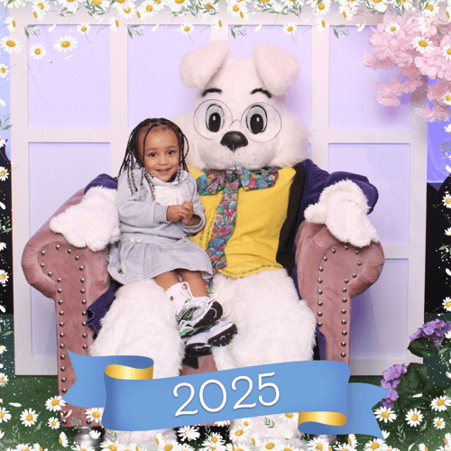 Young girl wearing a pastel dress and posting with the Easter Bunny (2)