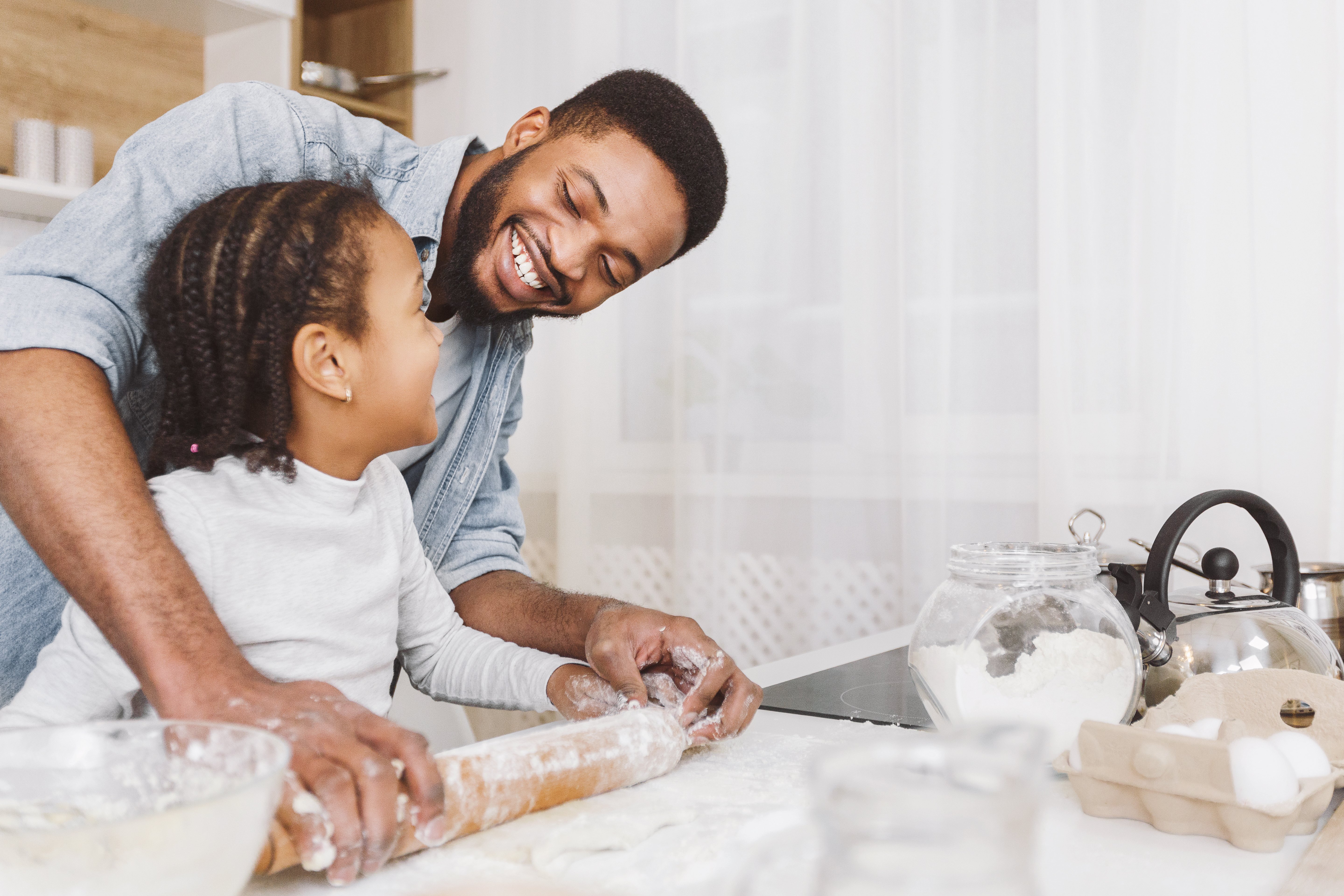 baking-family-father-and-daughter-bake-in-kitchen-together
