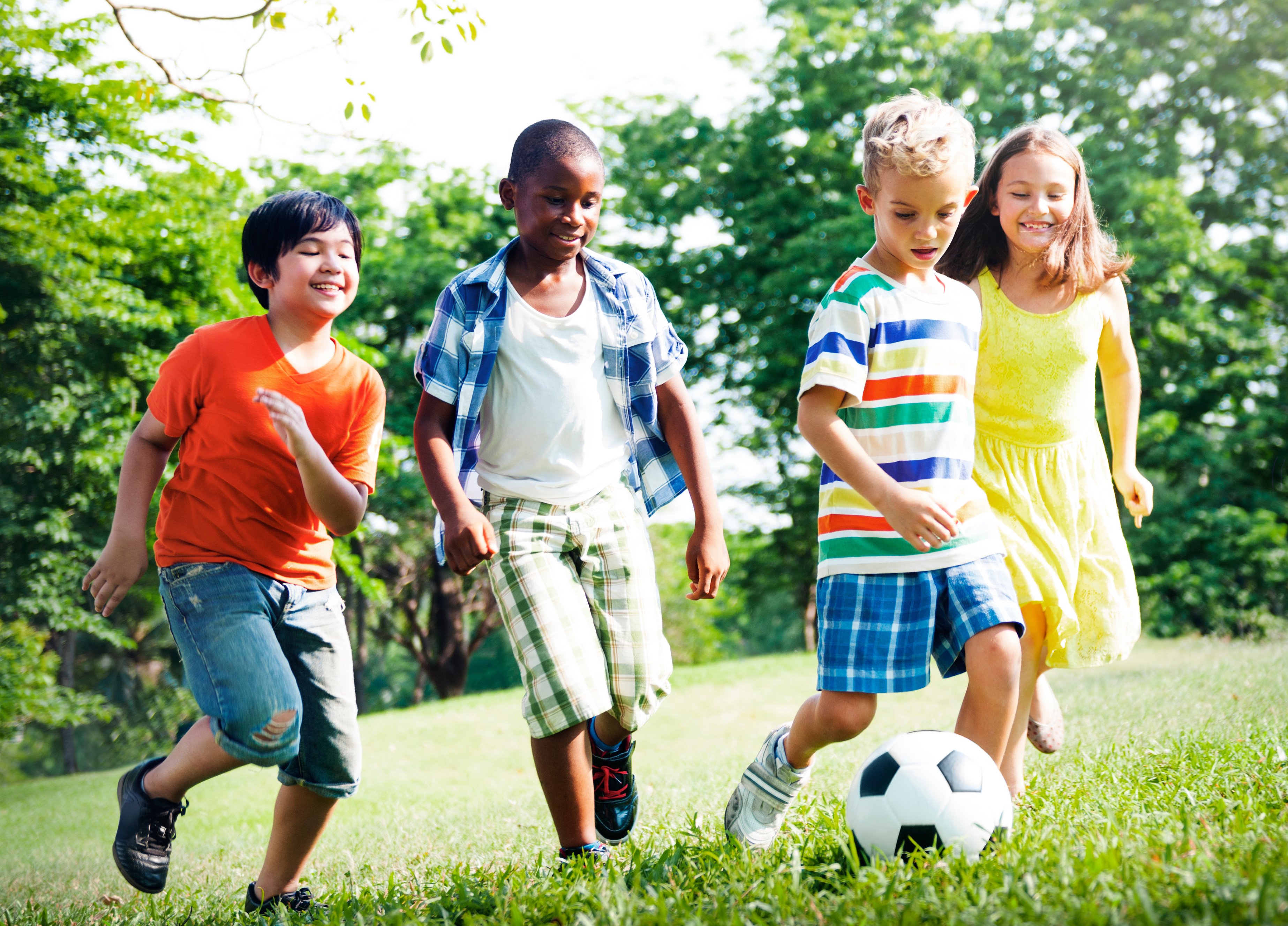 group-of-kids-playing-soccer-together-ball