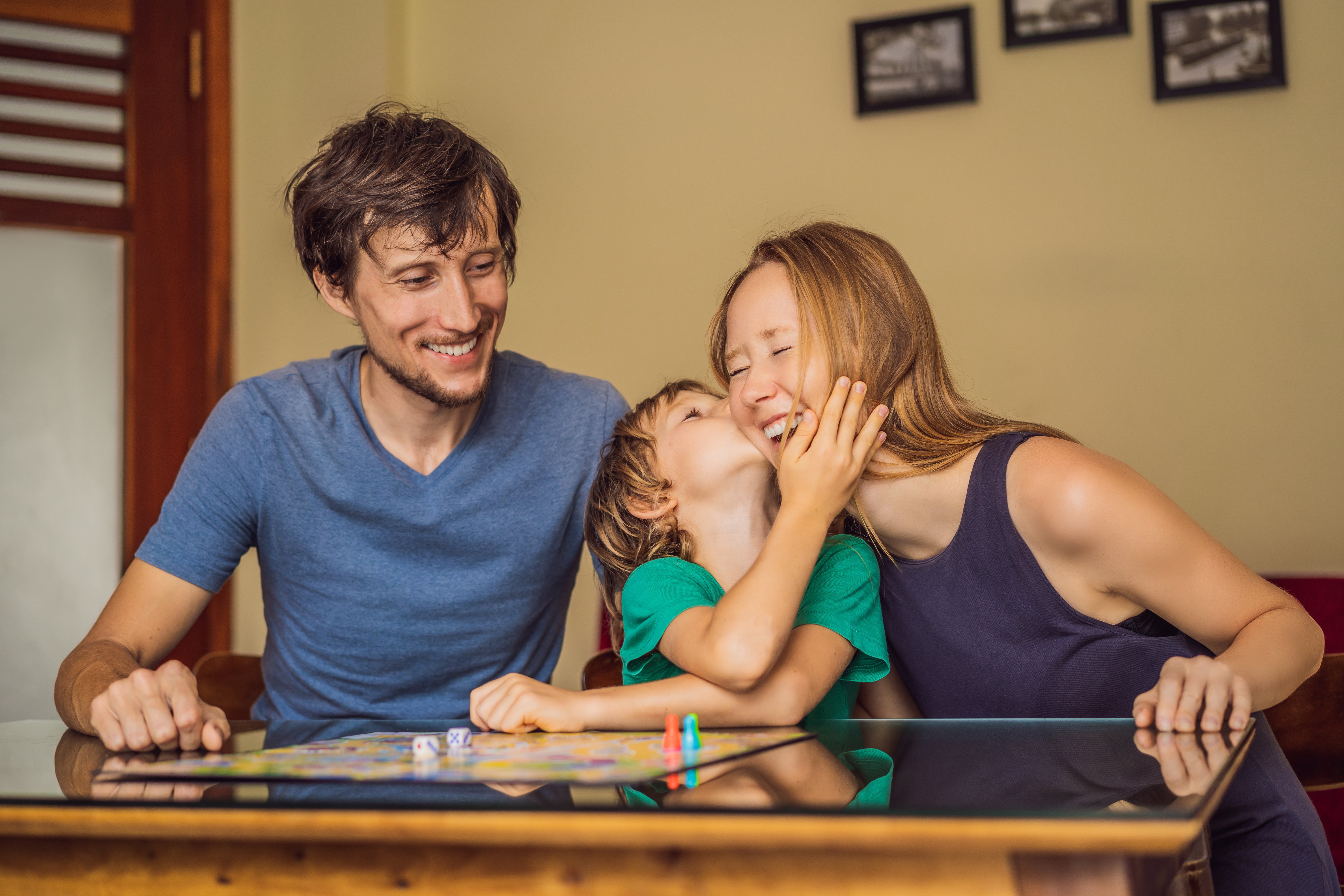 board-game-family-playing-games-seated-at-table