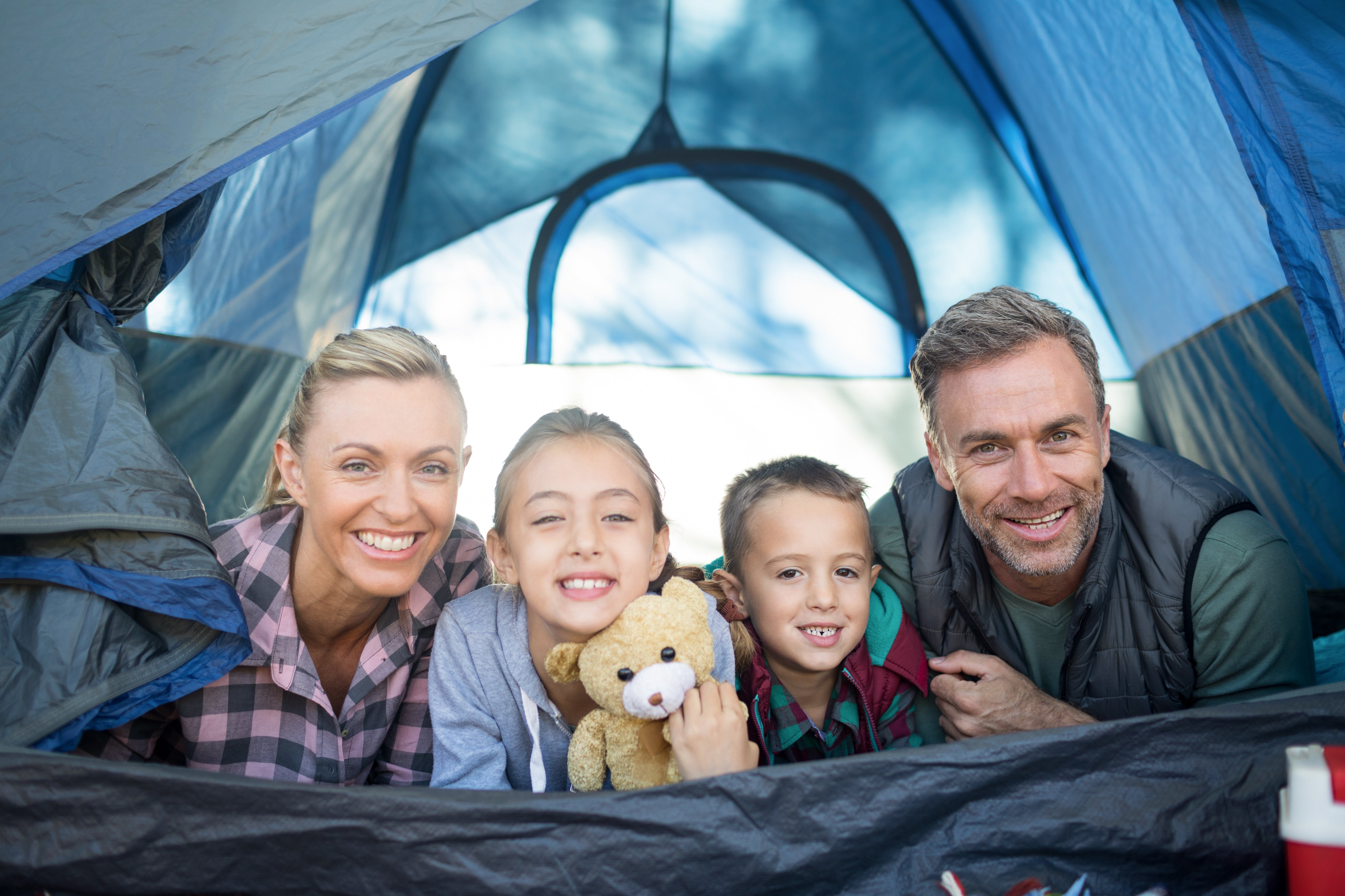 camping_family-mother-father-daughter-son-tent-camp-outdoors