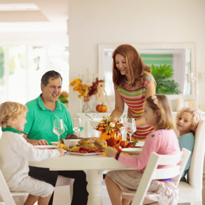 Family enjoying a Thanksgiving dinner.