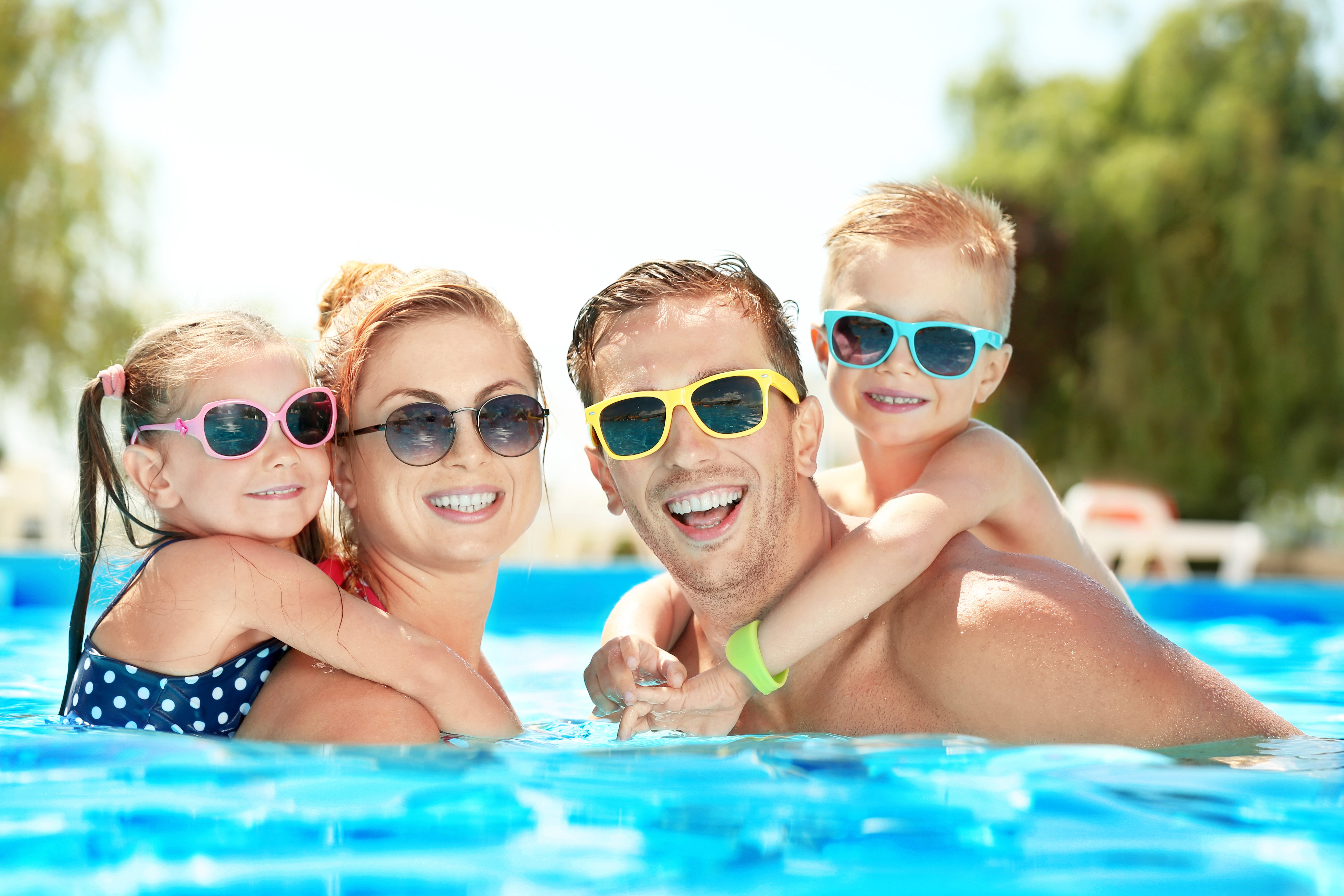 family-going-for-a-swim-swimming-pool