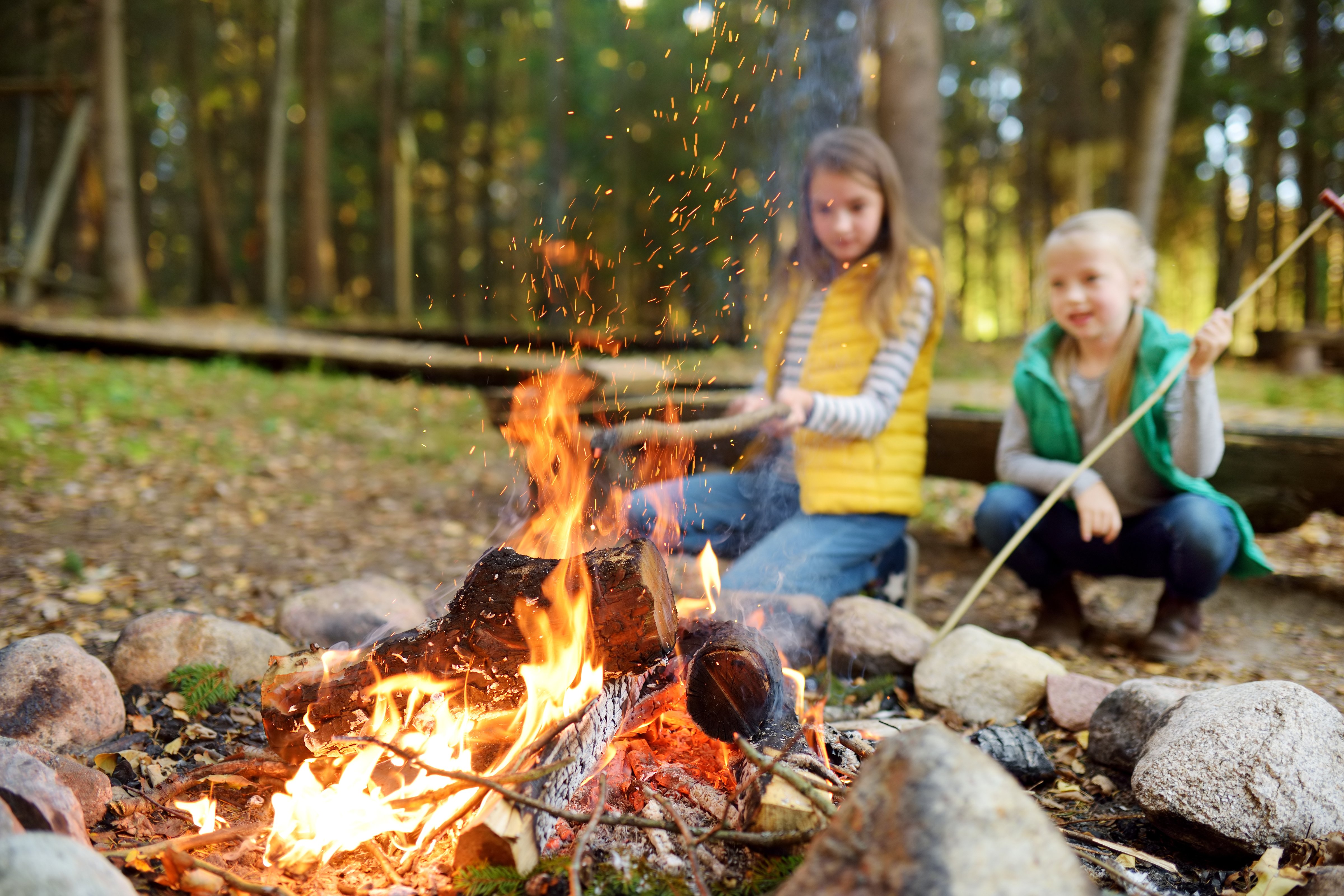 fire-girls-making-smores-in-front-of-bonfire