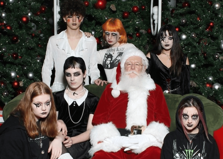group of goths taking a photograph with santa
