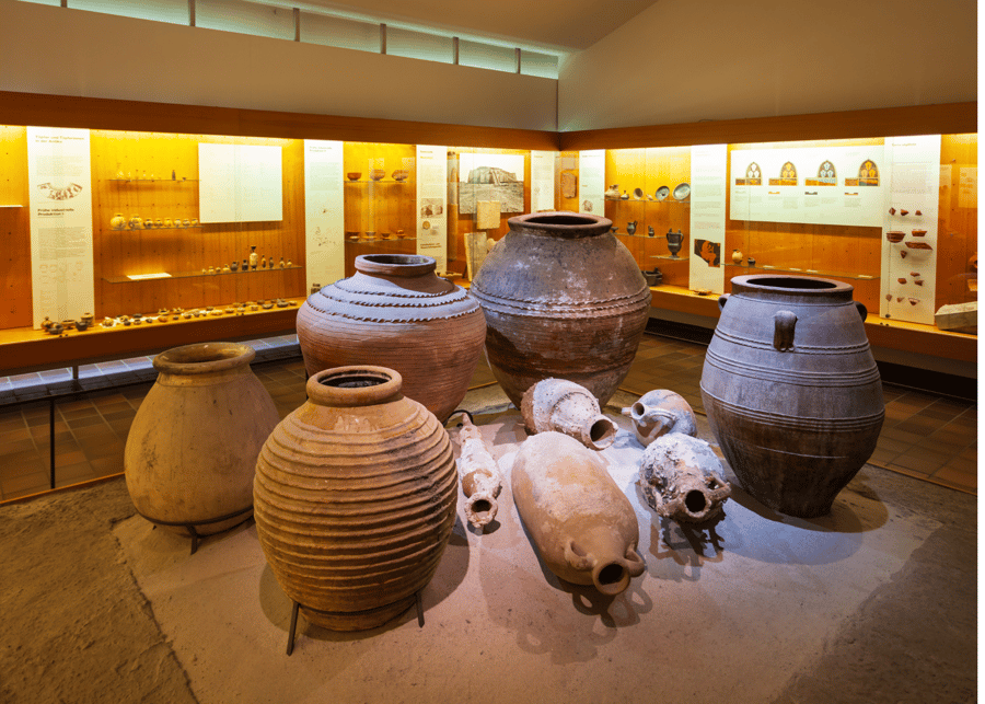 museum exhibit of clay pots and bowls